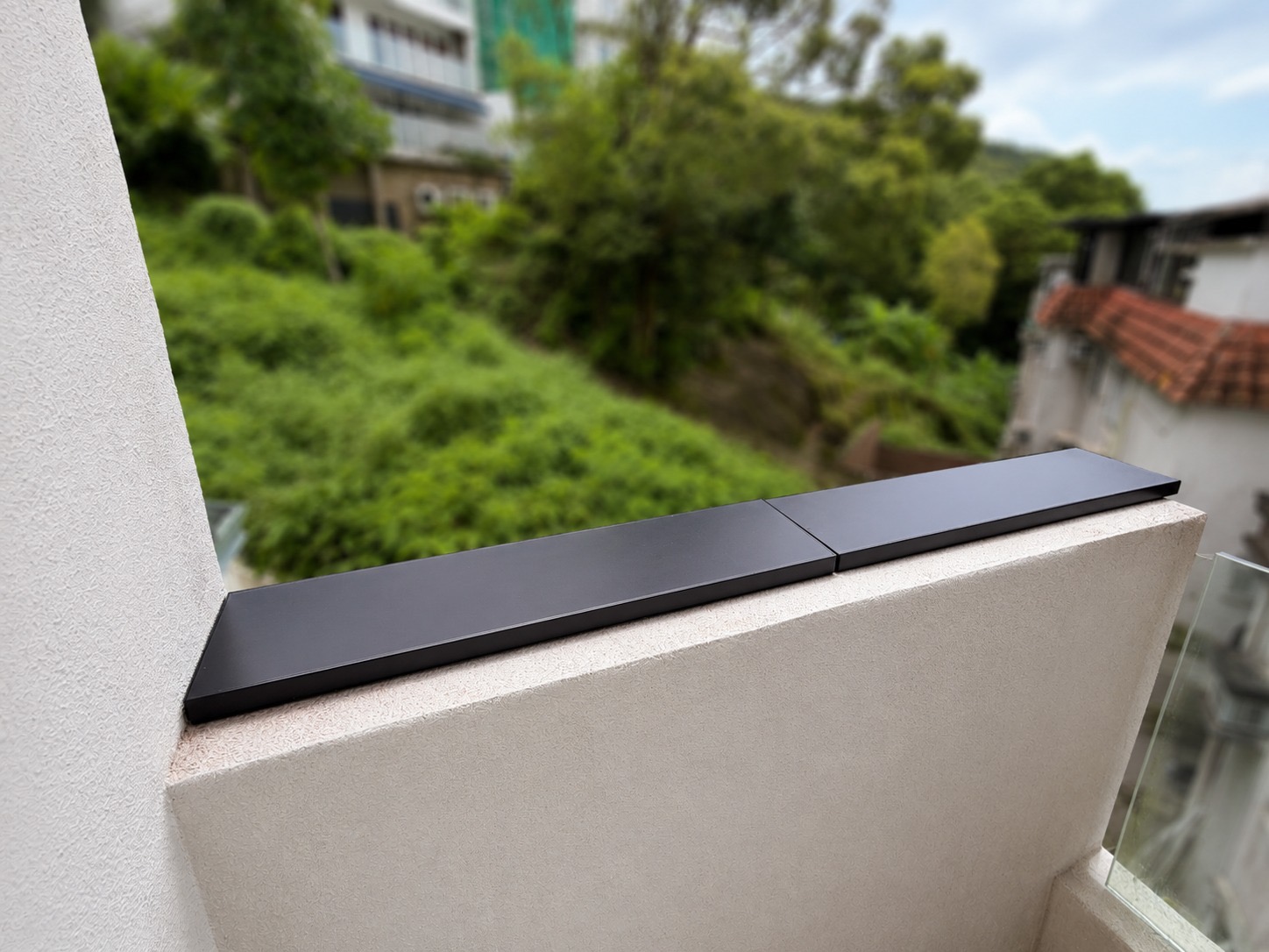 Two aligned Apeiron Guard battery-free climb detection sensors on a completed residential wall