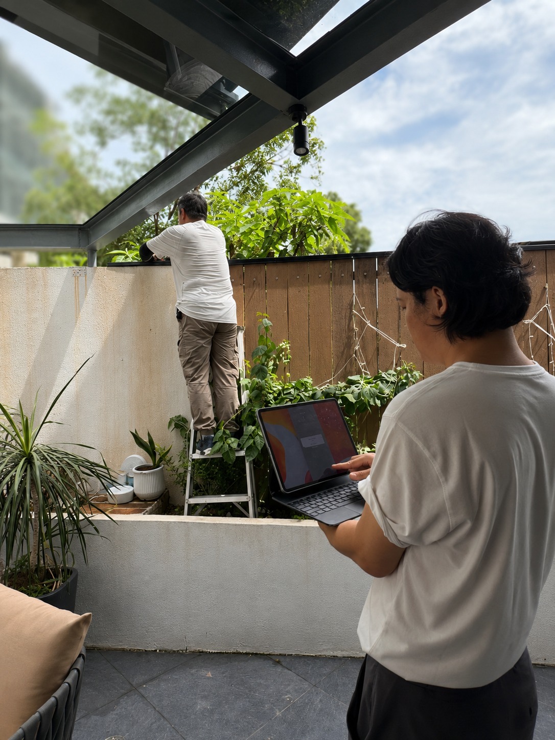SecurePro commissioning Apeiron Guard perimeter sensors and testing Mini Alarm Hub zones on a tablet