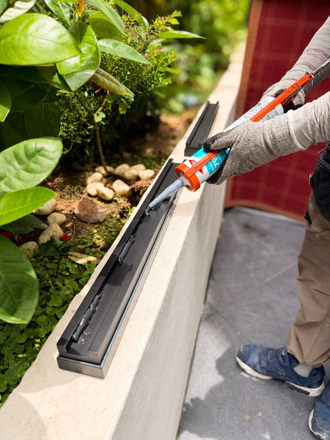 Structural adhesive applied to an Apeiron Guard wall-top sensor during installation